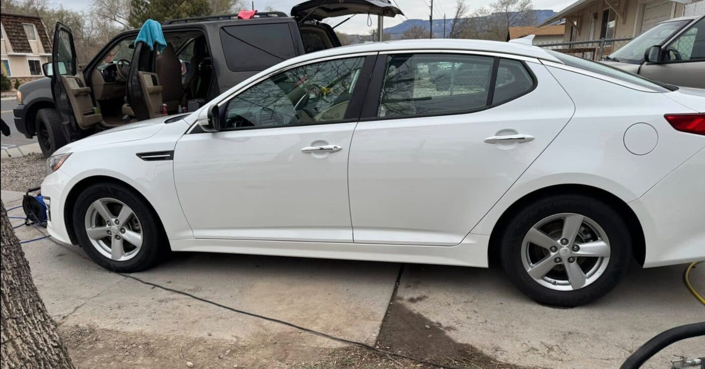 Freshly washed white Kia Optima, spotless paint